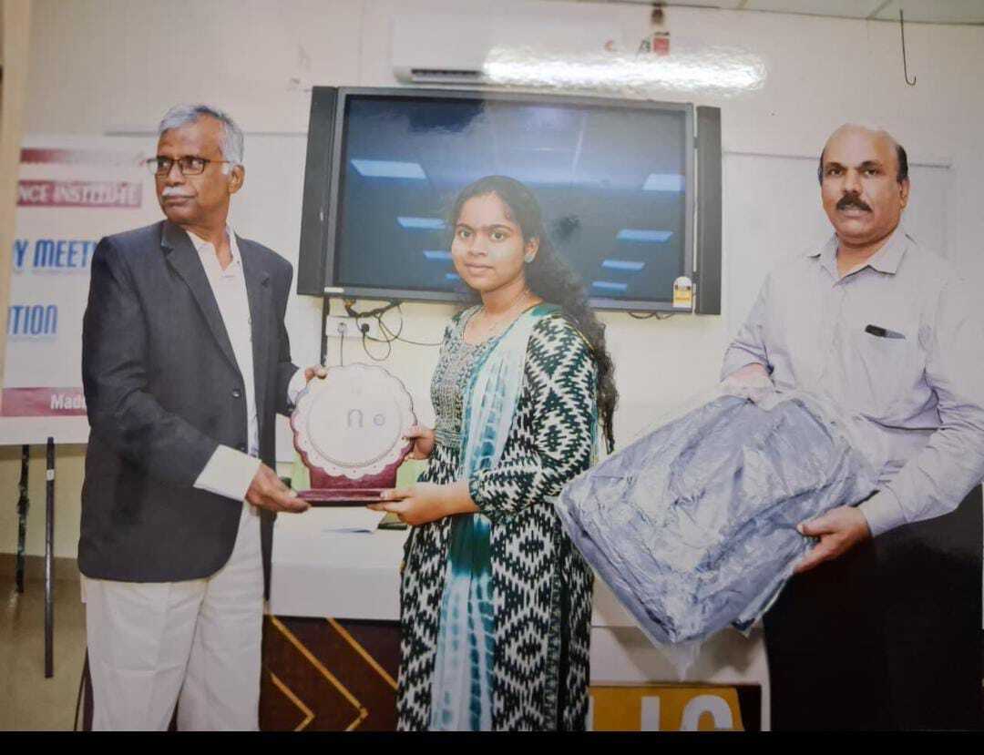 LIC  of Madurai  honored her  with Memento and prize